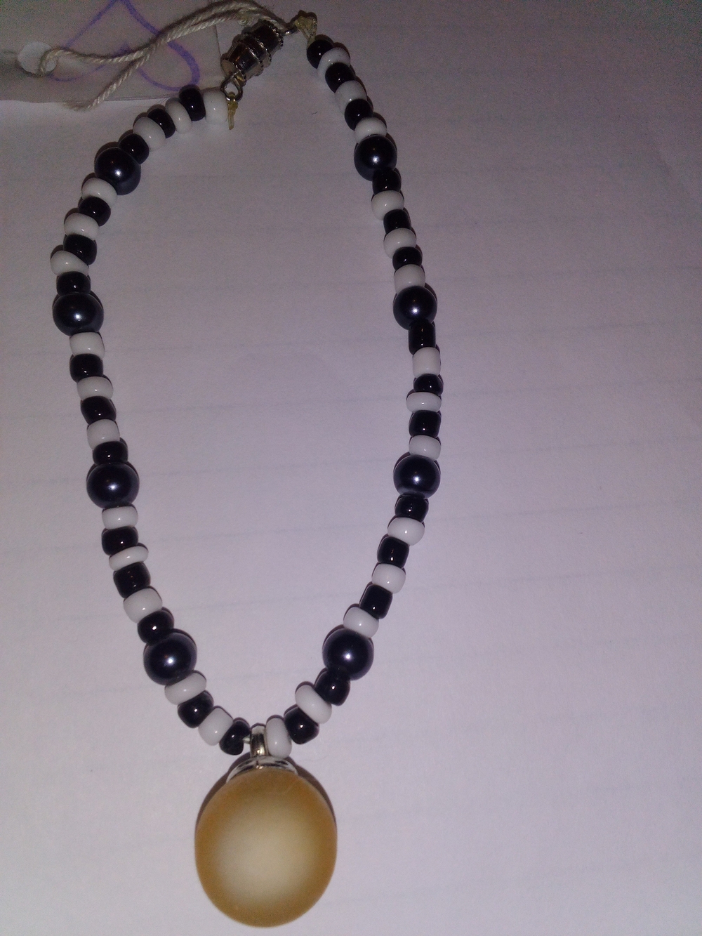 Black and White Beaded Bracelet with Gold Pendant